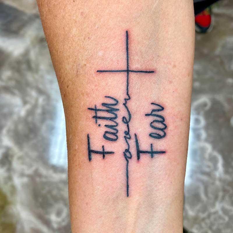 Faith Over Fear Tattoo with a Cross