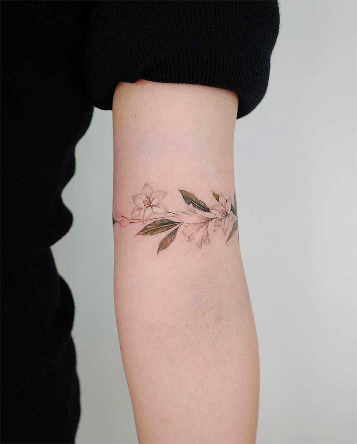 simple flower wrist tattoos