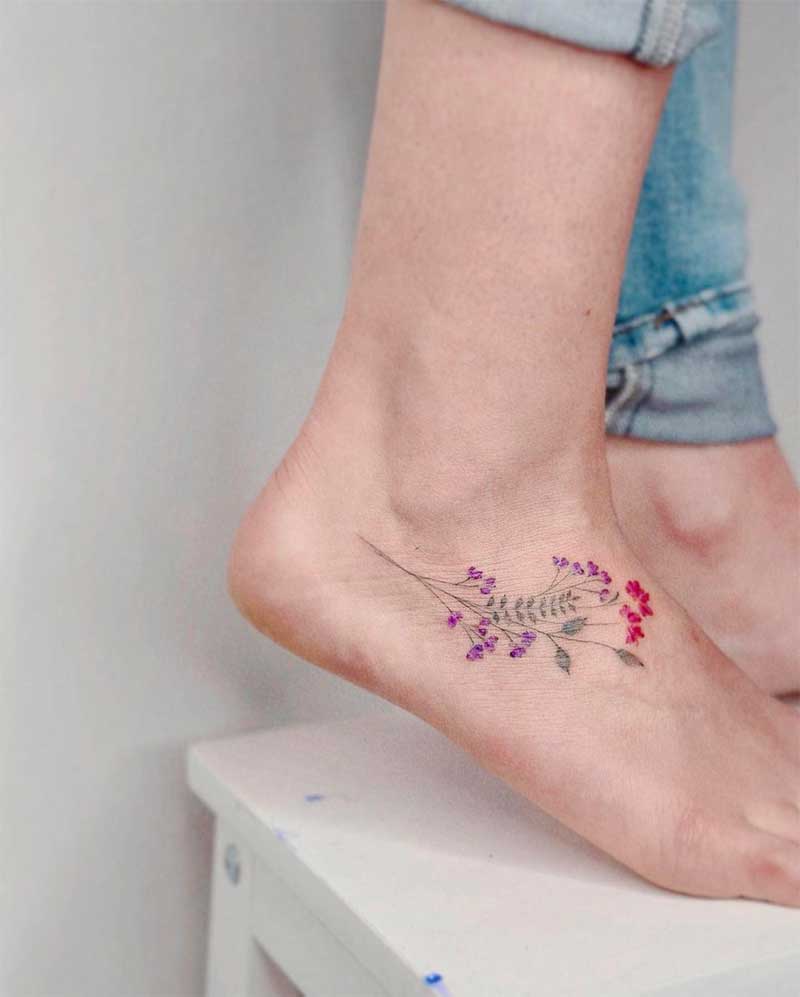 A young woman with a foot tattoo.