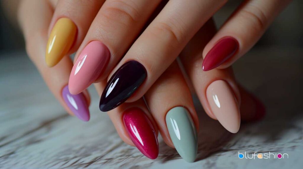 Assorted Korean gel nail polish colors in almond-shaped manicure on female hand.