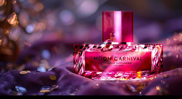 Vilhelm Parfumerie's Moon Carnival perfume bottle with radiant pink hue and gold accents on a purple backdrop.