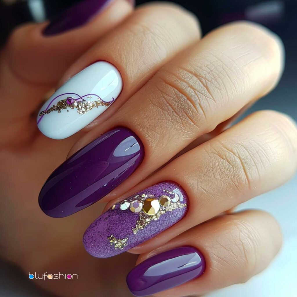 Hand with mixed purple nail designs, featuring glitter, sequins, and delicate swirl patterns.