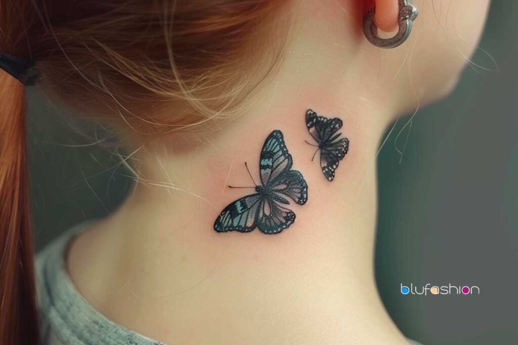 small butterfly neck tattoos: Detailed black butterfly tattoos on woman's neck beside hoop earring.